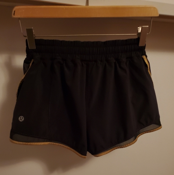 Lululemon Super Squad shorts. Black and gold. Size 6. Built in liner. - Picture 5 of 12